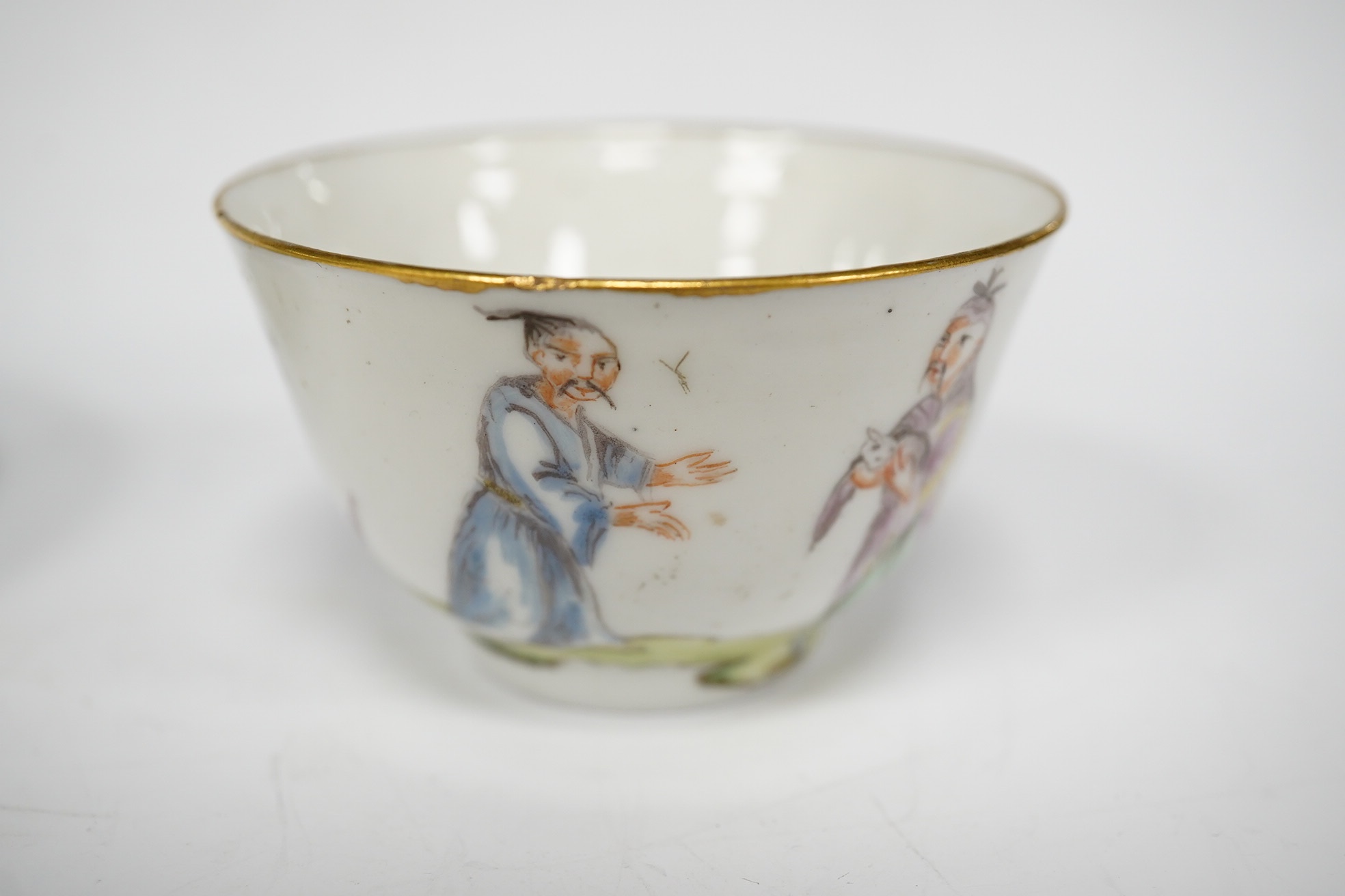 A Nove porcelain tea bowl and saucer, c.1770-75, hand painted with Chinese figures, iron red asterisk marks, 11.5cm in diameter
